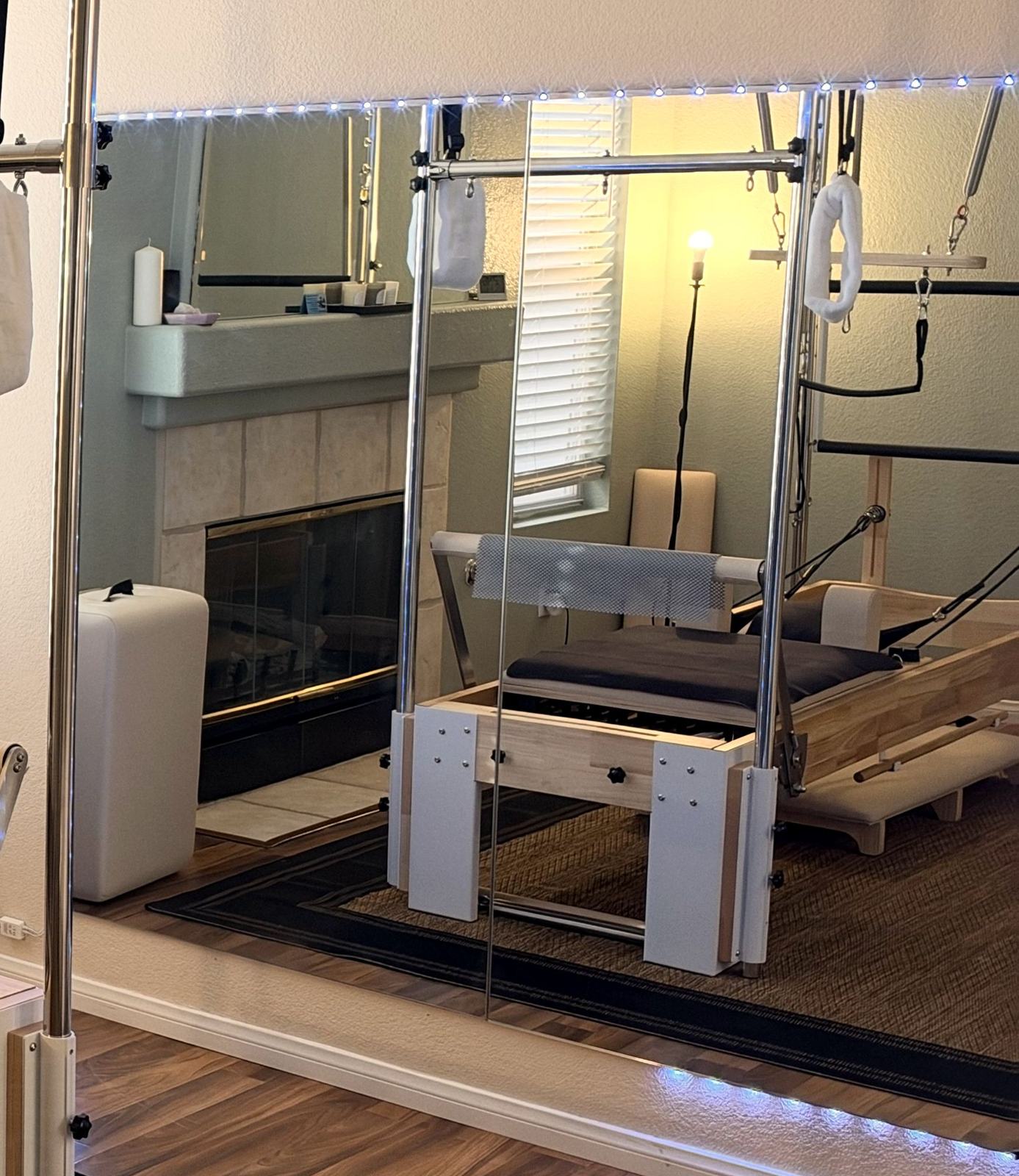 The mirrored wall reflecting the studio
