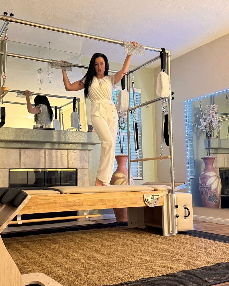 Eve Museri standing on the Reformer in her Summerlin studio