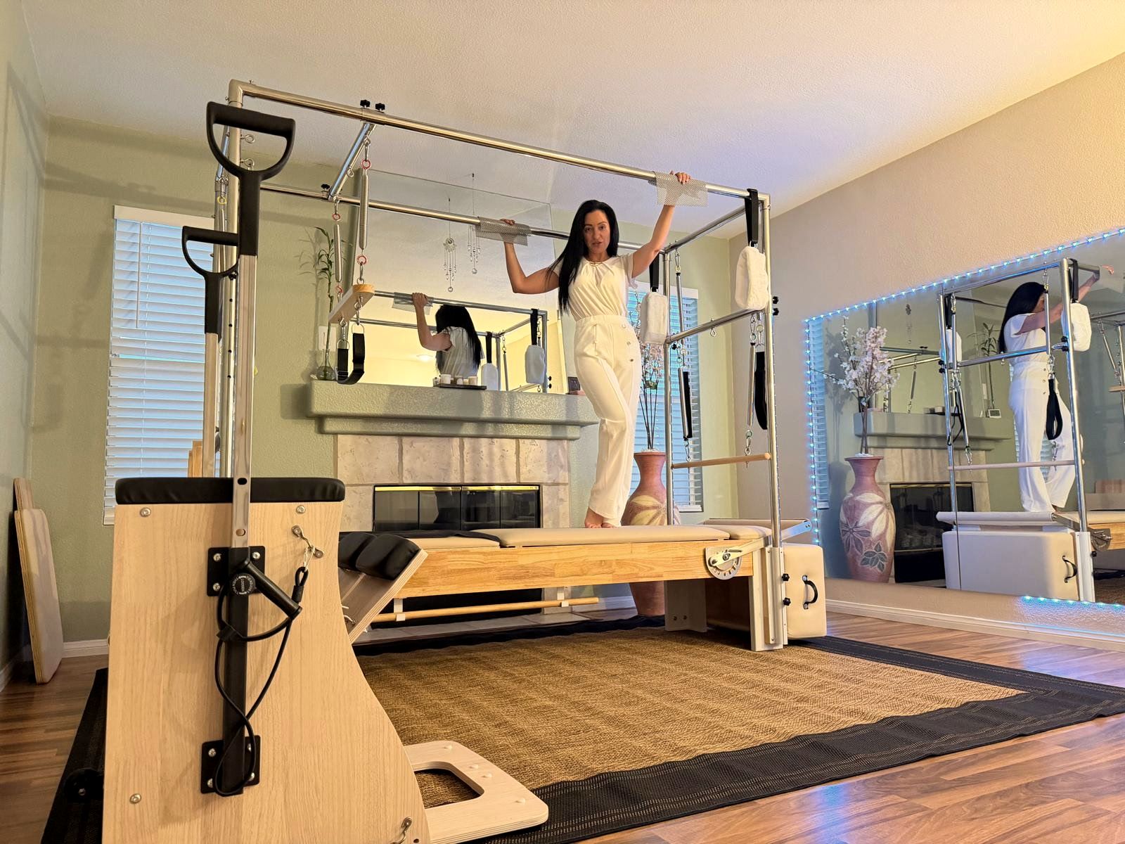 Eve Museri in her studio with the Wunda Chair, Reformer and Cadillac