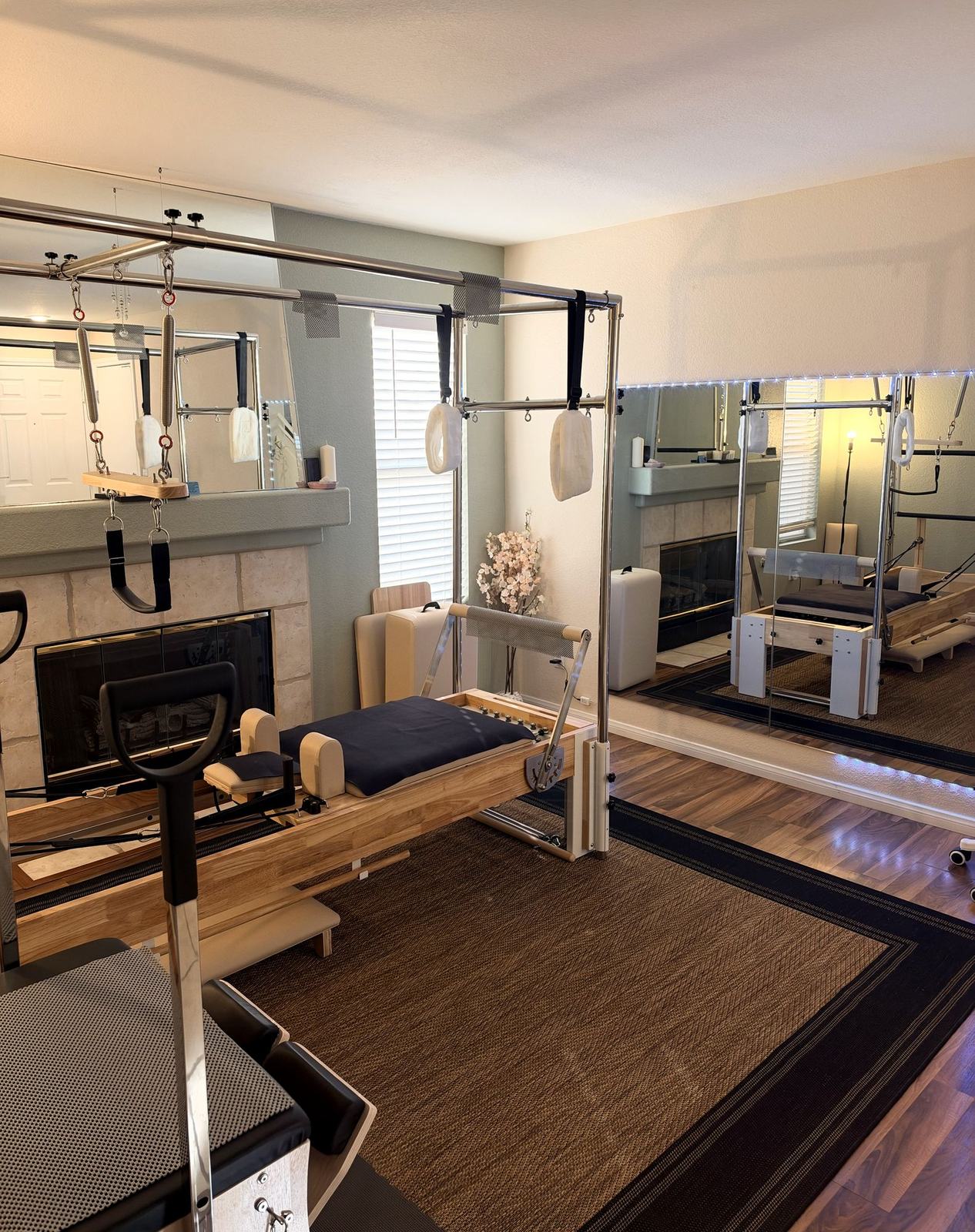 Eve's boutique studio, with the Reformer, Cadillac and mirrored wall